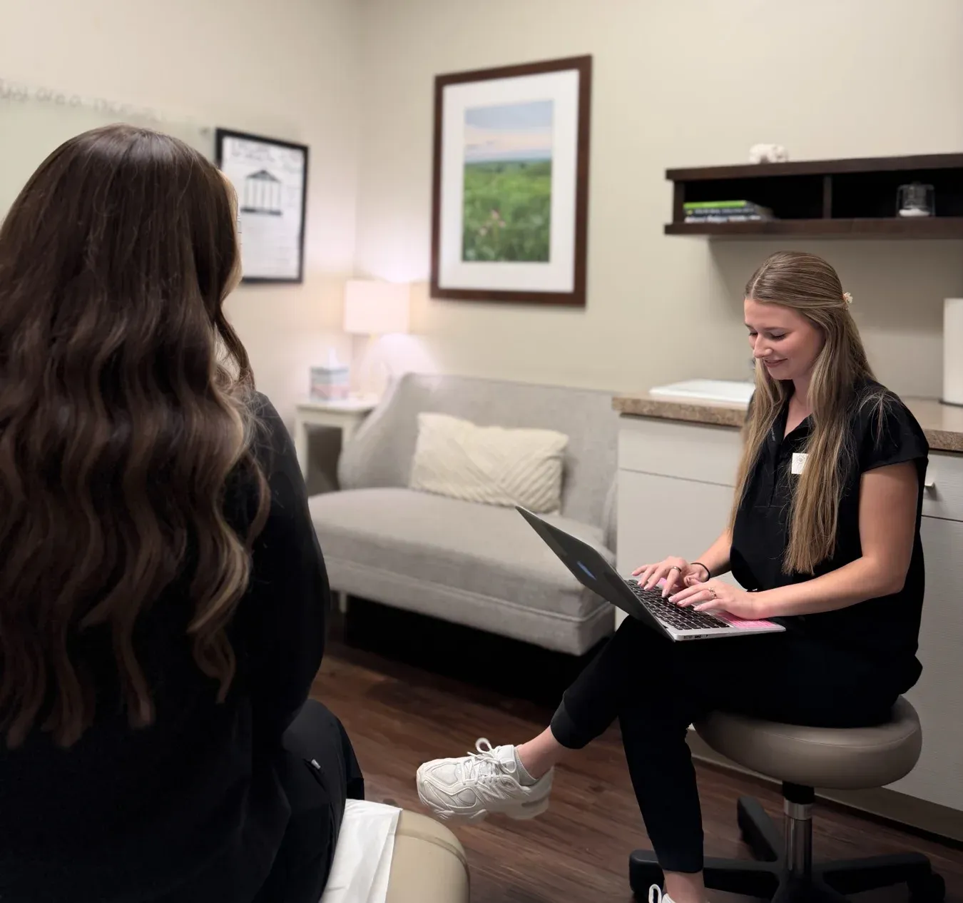 A Prairie Health & Wellness nurse taking notes during a one-on-one visit